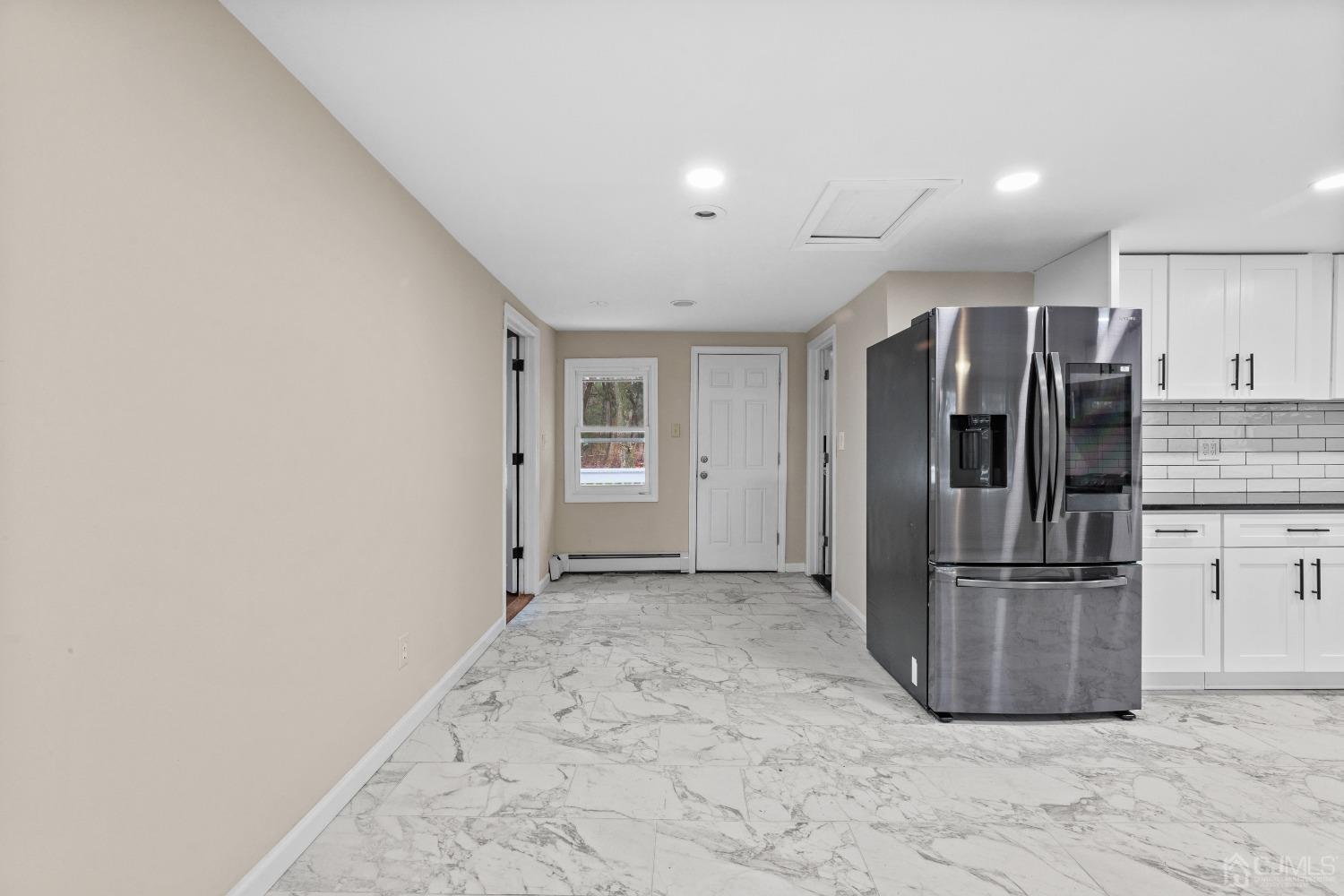145 Texas Road Old Bridge, NJ 08857 - Photo 26 of 35 a view of a refrigerator in kitchen and an empty room