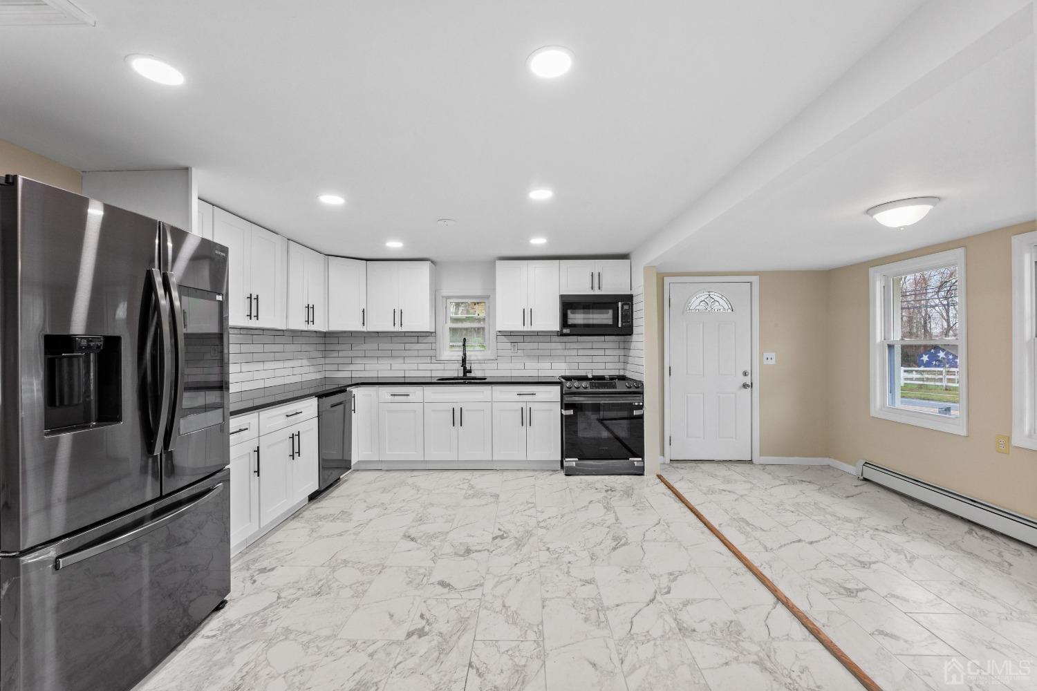 145 Texas Road Old Bridge, NJ 08857 - Photo 30 of 35 a large kitchen with stainless steel appliances granite countertop a refrigerator sink and cabinets