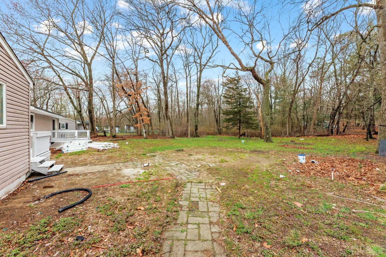 145 Texas Road Old Bridge, NJ 08857 - Photo 4 of 35 a view of a yard with an trees
