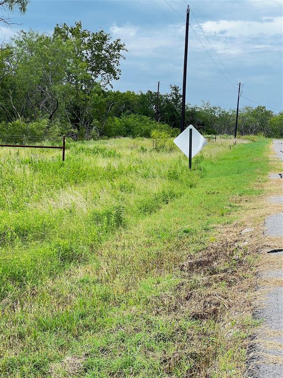 Lot 75 Wolf Ranch Corsicana, TX 75110 - Photo 18 of 19 a view of a garden with a bench in a lake