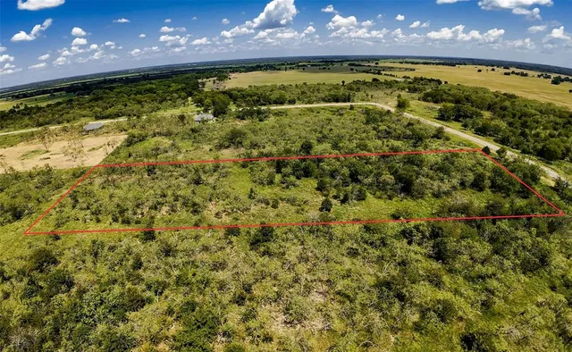 a view of a yard with a swimming pool