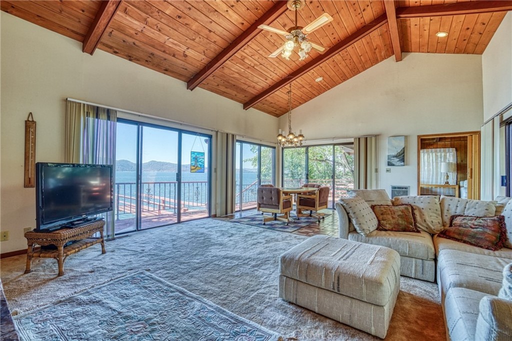 7783 Cora Drive Lucerne, CA 95458 - Photo 12 of 41 a living room with furniture and a flat screen tv