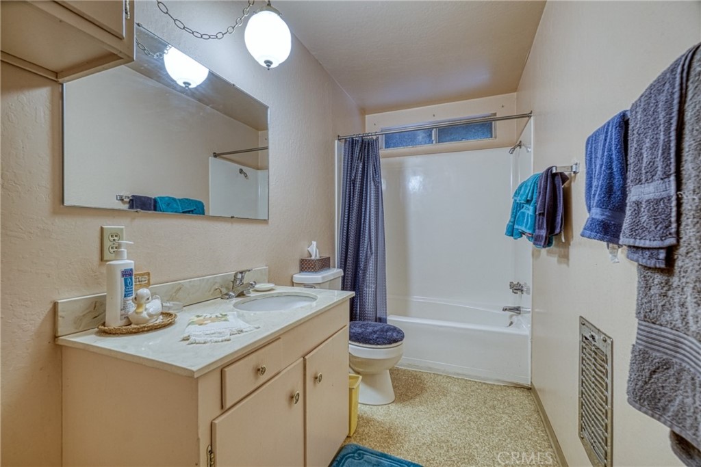 7783 Cora Drive Lucerne, CA 95458 - Photo 19 of 41 a bathroom with a sink a toilet and shower