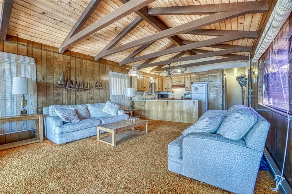 7783 Cora Drive Lucerne, CA 95458 - Photo 9 of 41 a living room with furniture and a chandelier