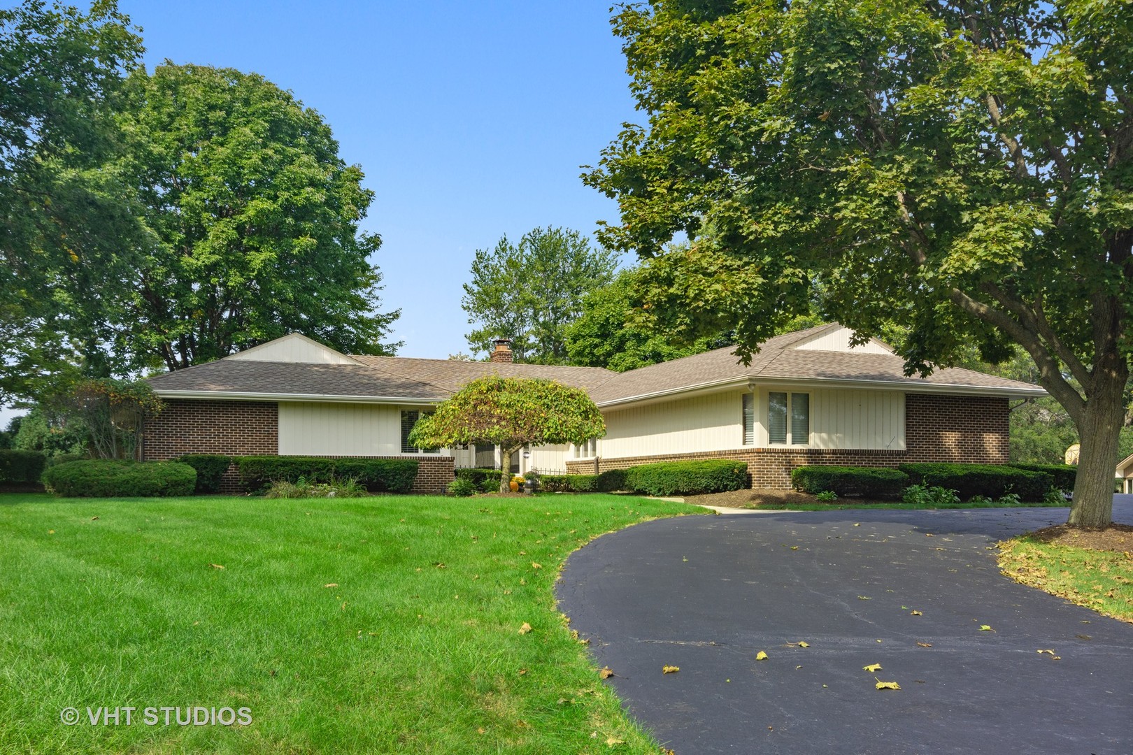 128 Colony Drive Inverness, IL 60010 - Photo 1 of 22 a front view of a house with garden