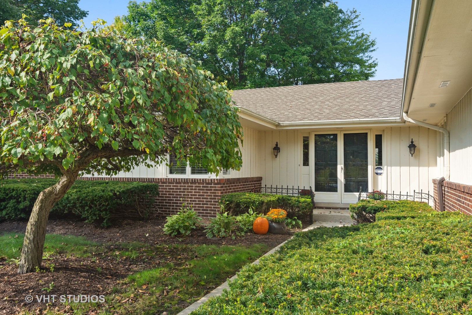 128 Colony Drive Inverness, IL 60010 - Photo 2 of 22 a front view of a house with garden