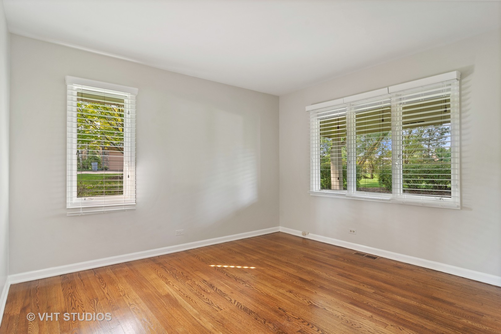 128 Colony Drive Inverness, IL 60010 - Photo 13 of 22 a view of an empty room with wooden floor and a window