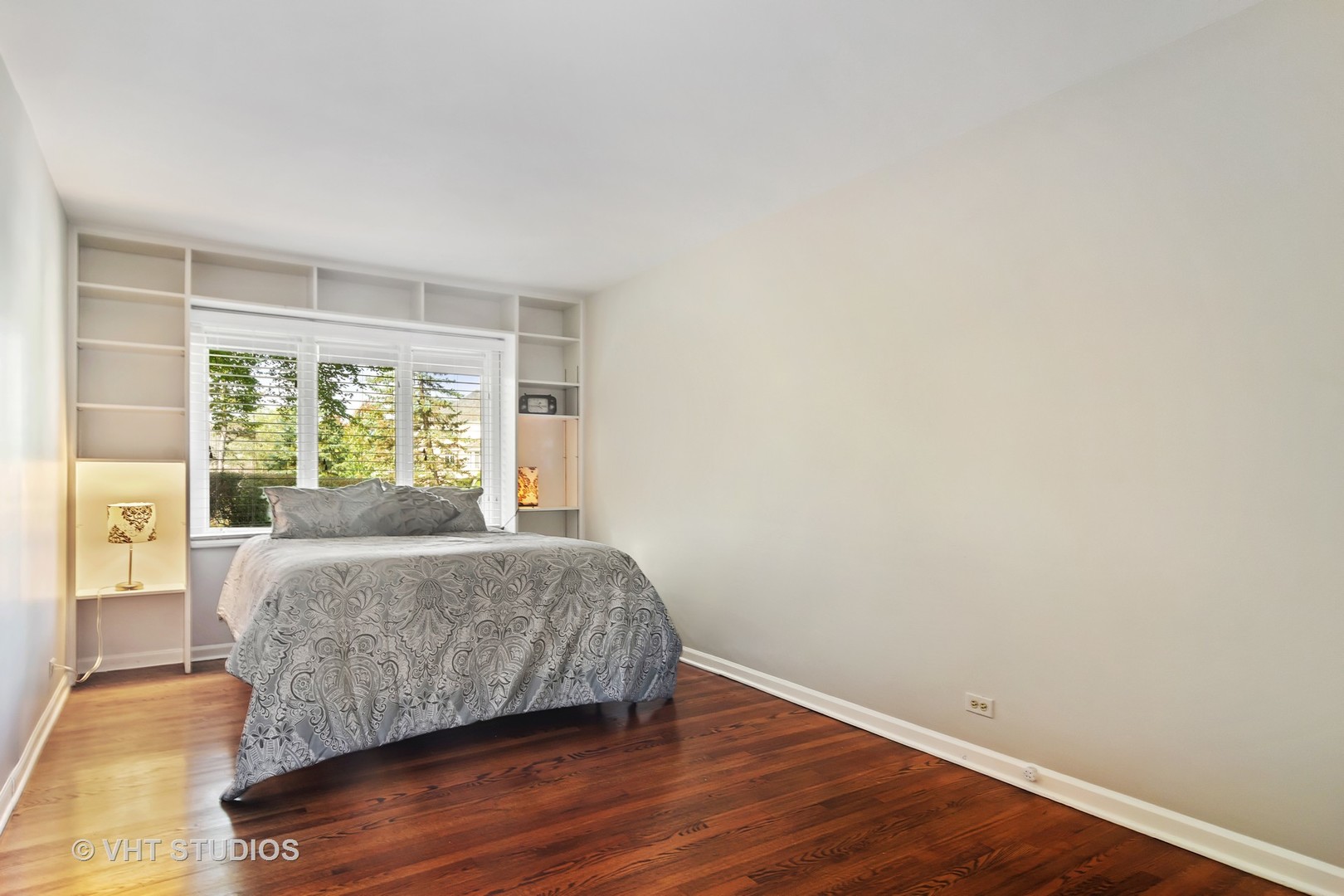 128 Colony Drive Inverness, IL 60010 - Photo 17 of 22 a room with a bed and wooden floor