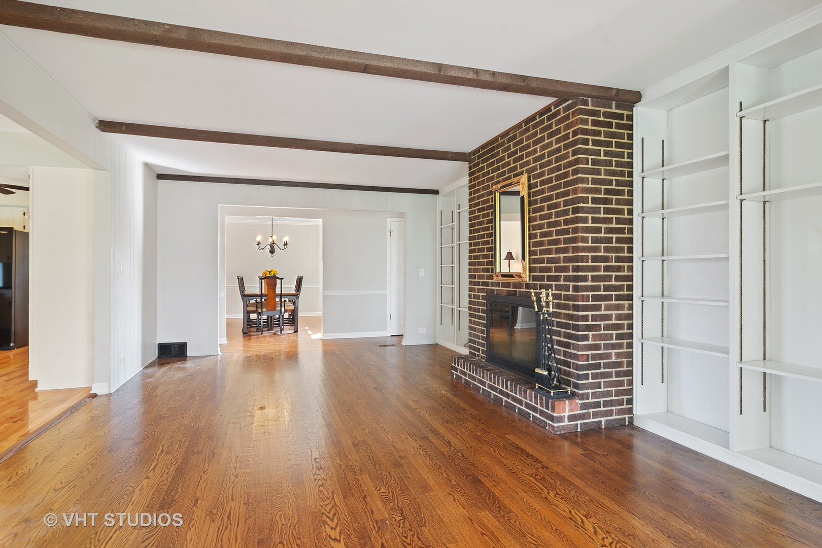 128 Colony Drive Inverness, IL 60010 - Photo 9 of 22 a view of a livingroom with wooden floor and a fireplace
