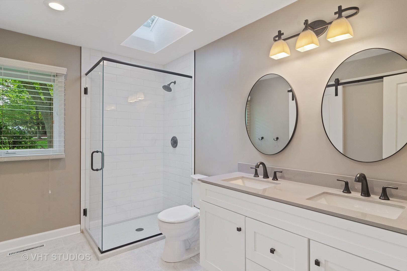 128 Colony Drive Inverness, IL 60010 - Photo 10 of 22 a bathroom with a double vanity sink mirror and toilet