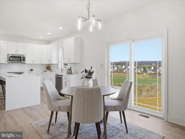 a view of a dining room with furniture window and outside view