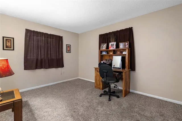 a room with workspace and a window