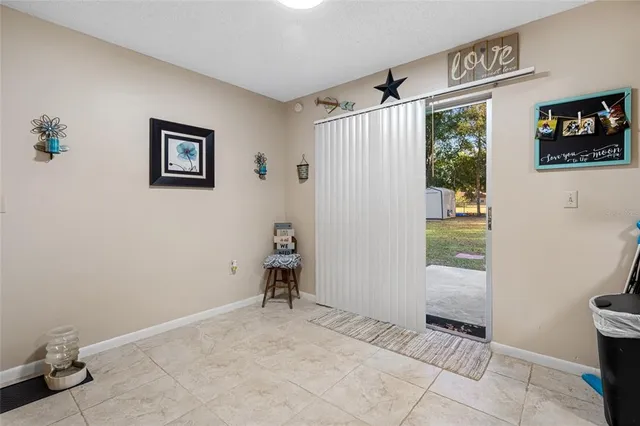 a view of a hallway with paintings on the wall