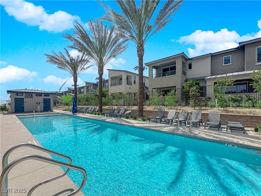 2467 Altitude Street Las Vegas, NV 89138 - Photo 2 of 7 Community pool featuring a patio area and a residential view