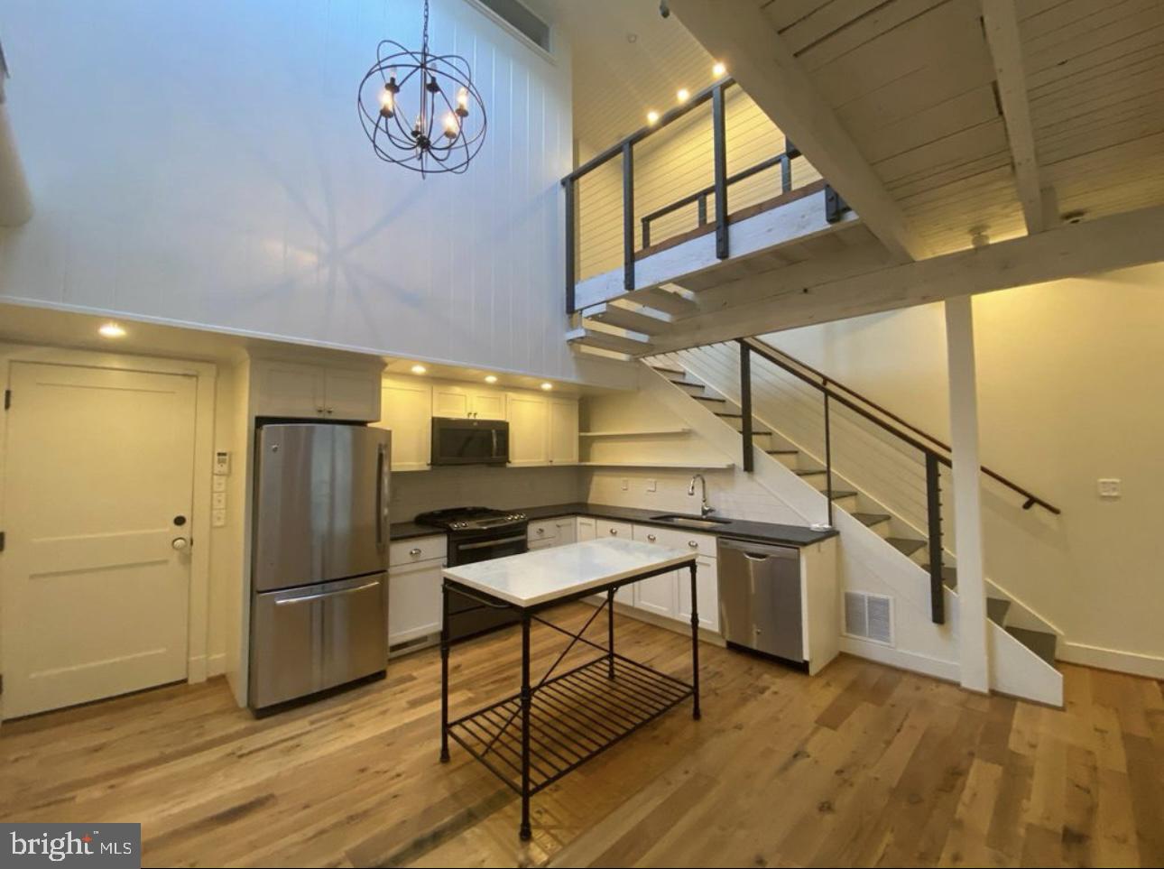 19 Branch Lane East Baltimore, MD 21202 - Photo 2 of 13 a view of a kitchen with furniture and a ceiling fan