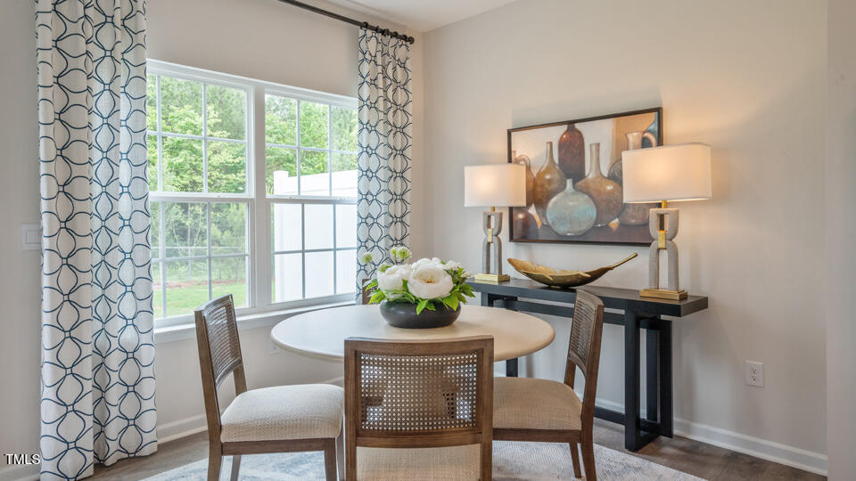 292 Perseus Street Angier, NC 27501 - Photo 16 of 35 a dining room with furniture and wooden floor
