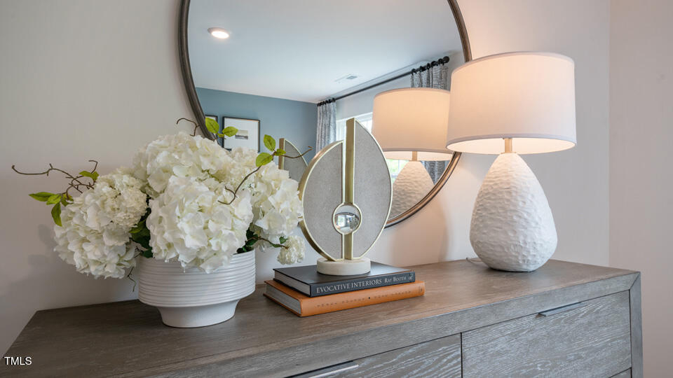 292 Perseus Street Angier, NC 27501 - Photo 2 of 35 a vase of flowers sitting on a table