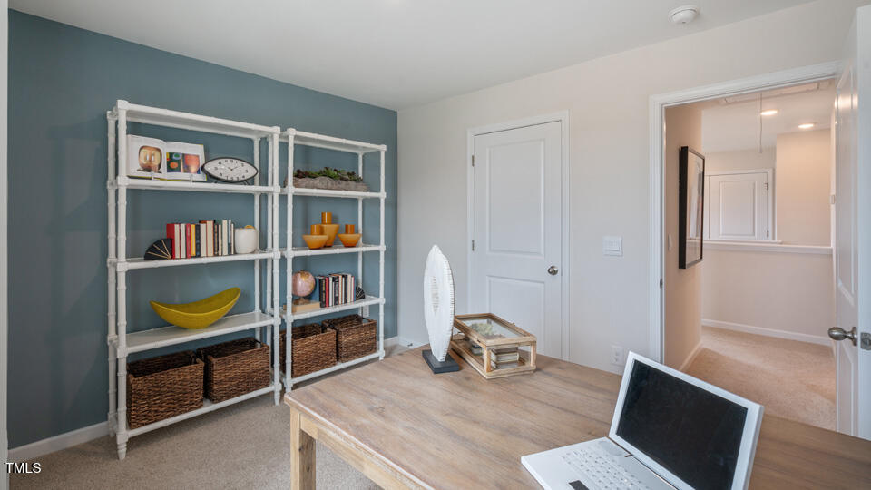 292 Perseus Street Angier, NC 27501 - Photo 24 of 35 a living room with fish tank and a bookshelf