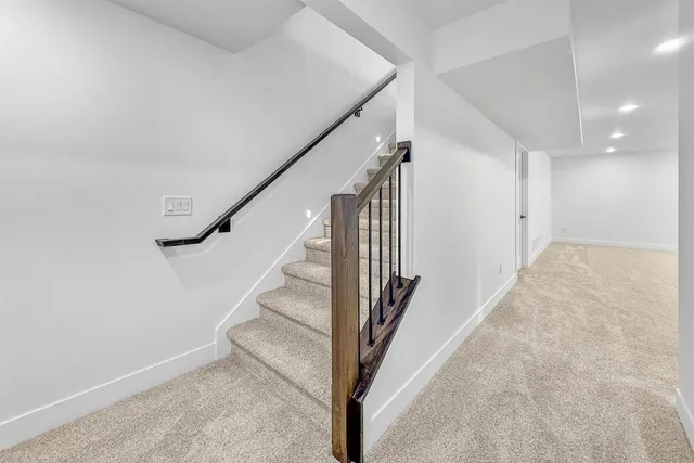a view of a hallway with staircase