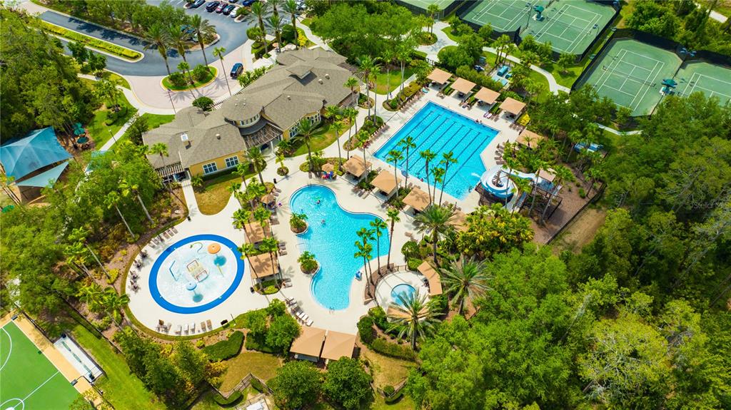 2409 Spring Hollow Loop Wesley Chapel, FL 33544 - Photo 36 of 47 an aerial view of a house with a yard and swimming pool