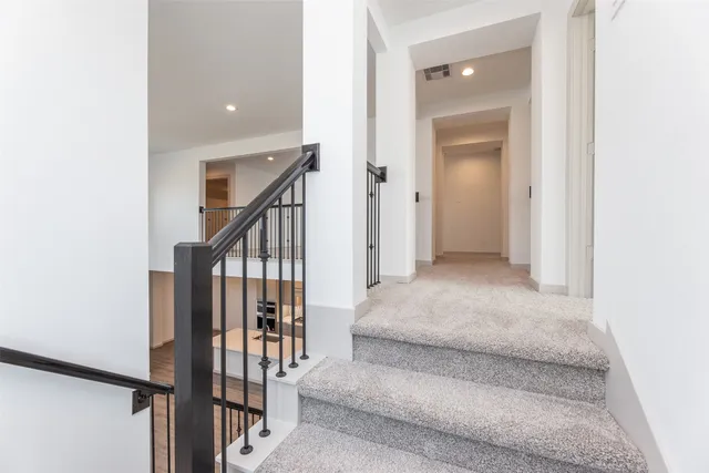 a view of entryway and hall with a rug
