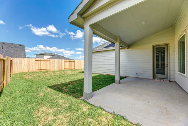 a view of a backyard of the house