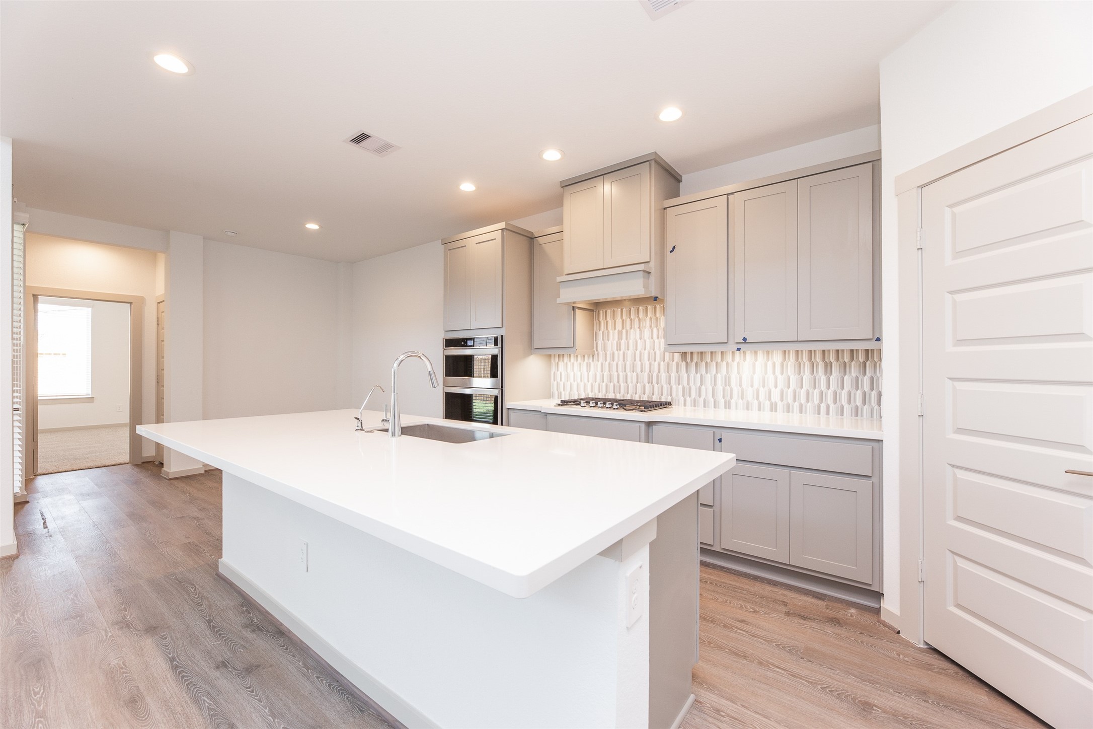 29502 Red Rocks Pk Drive Katy, TX 77494 - Photo 9 of 17 a kitchen with kitchen island a stove a sink and a refrigerator