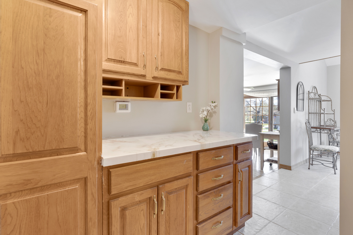 102 Harding Avenue Fox River Grove, IL 60021 - Photo 12 of 29 a kitchen with cabinets and window