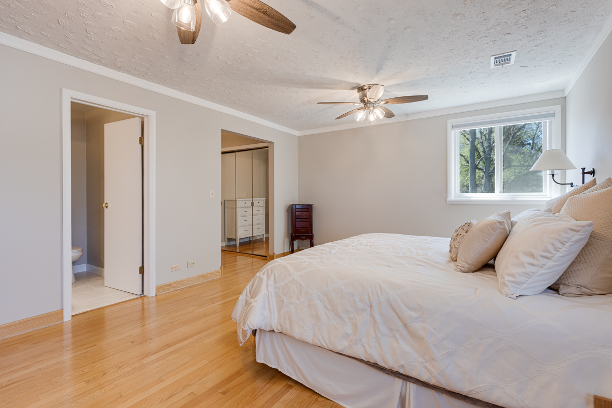 102 Harding Avenue Fox River Grove, IL 60021 - Photo 18 of 29 a bedroom with a bed and wooden floor