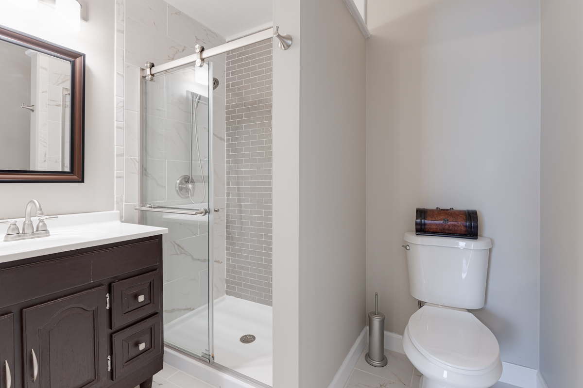 102 Harding Avenue Fox River Grove, IL 60021 - Photo 19 of 29 a bathroom with a sink a toilet and shower