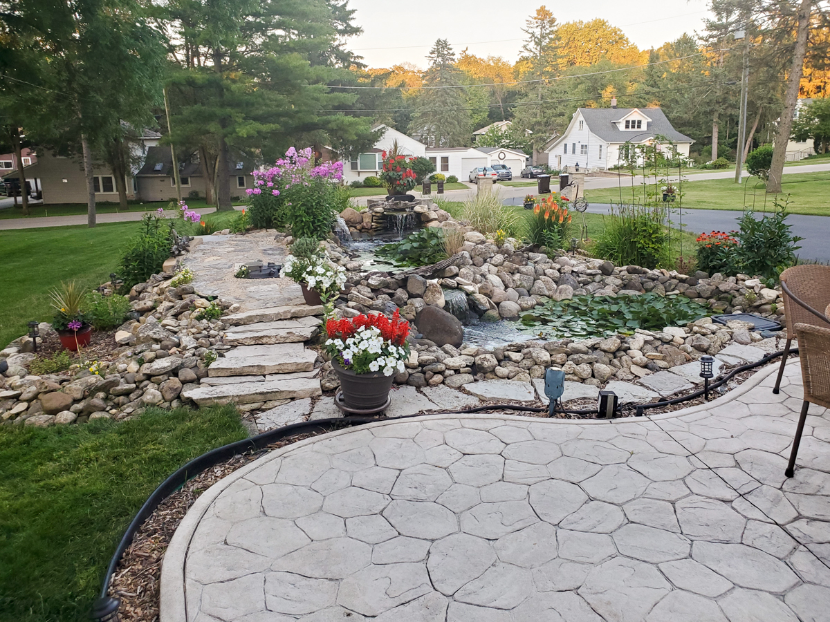 102 Harding Avenue Fox River Grove, IL 60021 - Photo 28 of 29 a view of a garden with a fountain