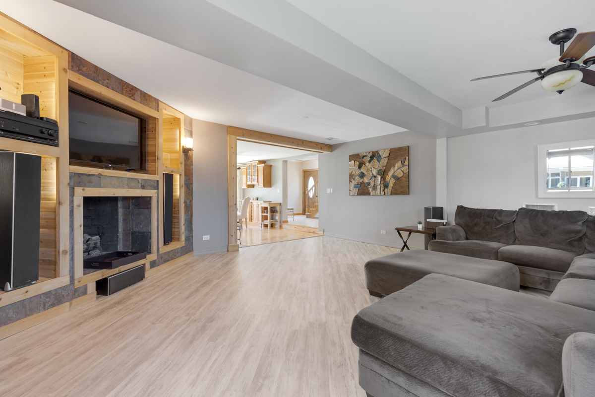 102 Harding Avenue Fox River Grove, IL 60021 - Photo 5 of 29 a living room with furniture a flat screen tv and a fireplace