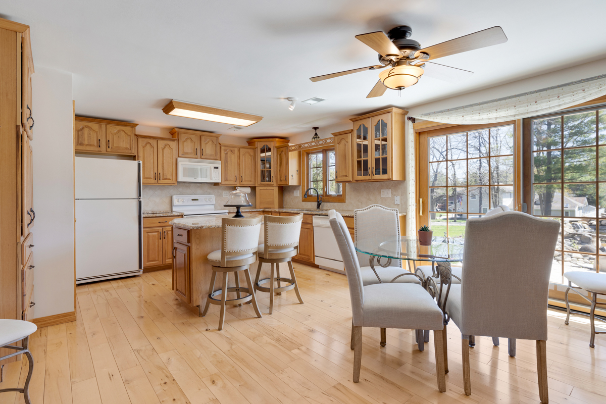 102 Harding Avenue Fox River Grove, IL 60021 - Photo 8 of 29 a dining room with furniture a chandelier and wooden floor