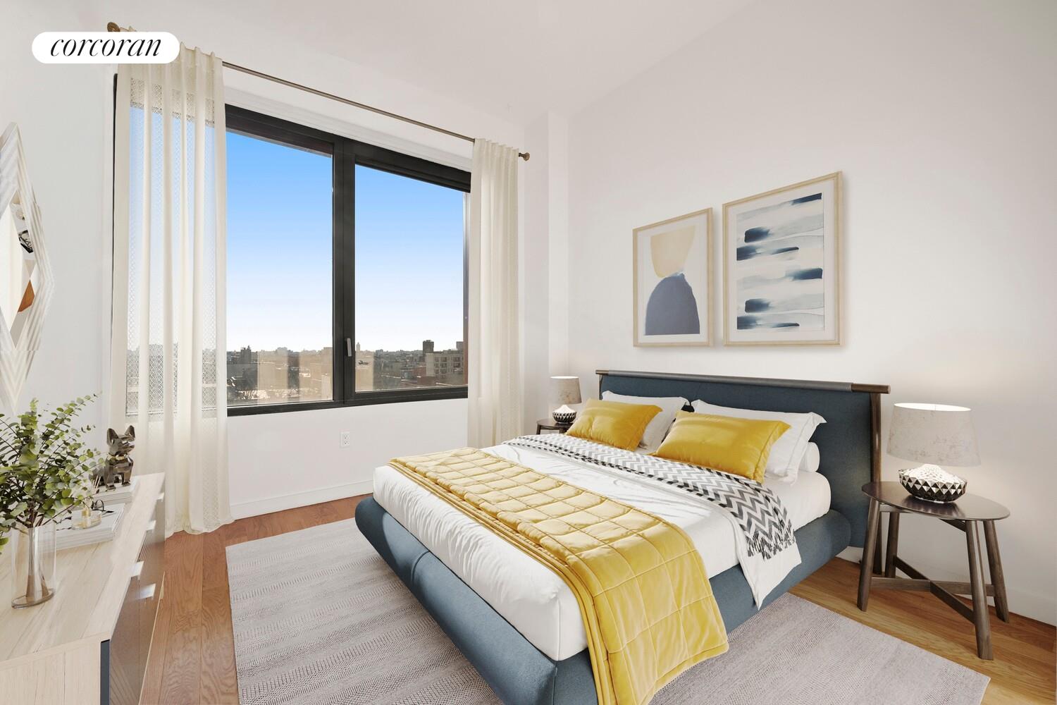 54 Noll Street, Unit 819 Brooklyn, NY 11206 - Photo 3 of 26 a bedroom with a bed and a large window