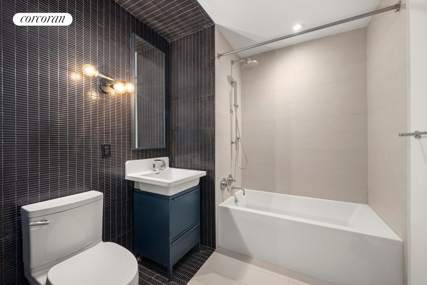 54 Noll Street, Unit 819 Brooklyn, NY 11206 - Photo 4 of 26 a bathroom with a sink toilet and shower