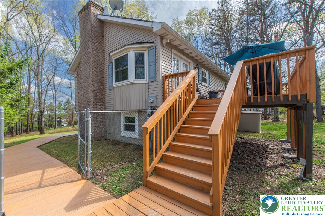 107 Shenkel Road Effort, PA 18330 - Photo 3 of 44 a view of backyard with deck and wooden floor