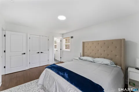 a bedroom with a bed and cabinets