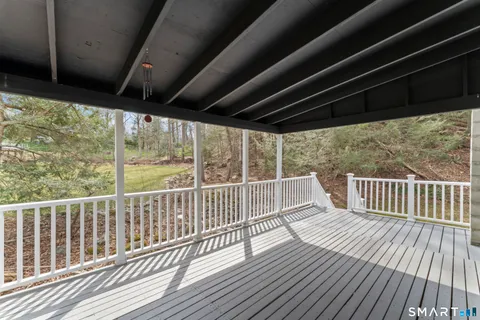 a view of a two chairs in the balcony