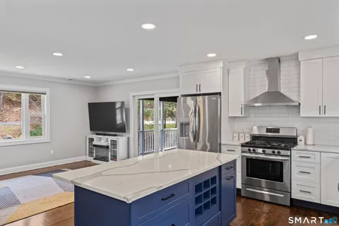 a kitchen with a stove a sink and a refrigerator