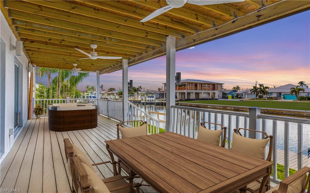 12277 Boat Shell Drive Matlacha Isles, FL 33991 - Photo 43 of 46 a view of a roof deck with a table and chairs