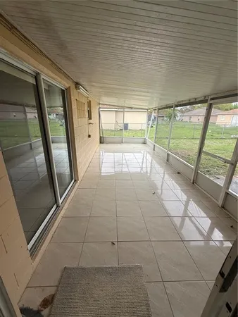 a view of a house with yard and sitting area