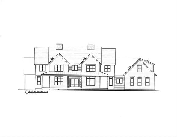 a white building with a white fence