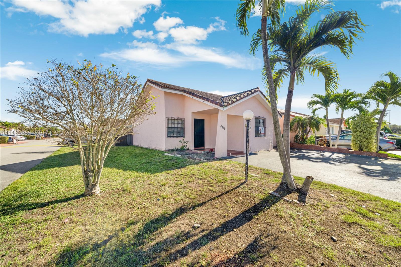 4531 Southwest 144th Avenue Miami, FL 33175 - Photo 18 of 24 a house with trees in the background