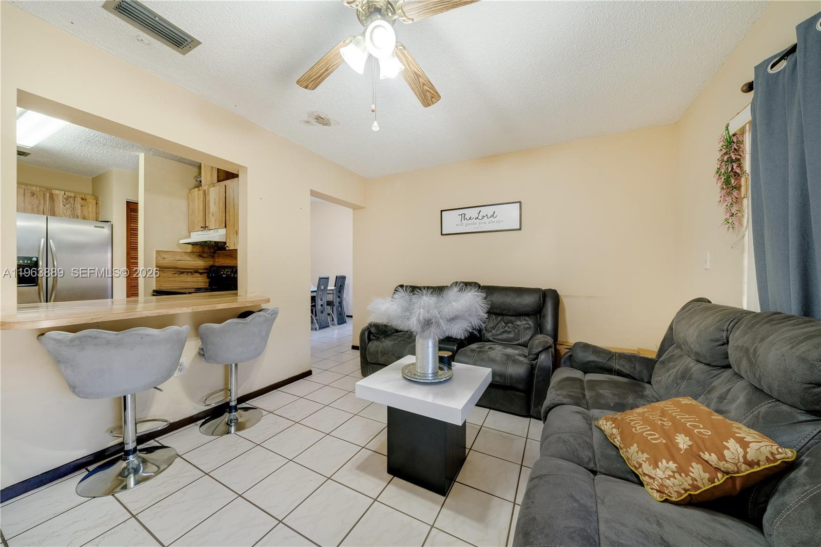 4531 Southwest 144th Avenue Miami, FL 33175 - Photo 4 of 24 a living room with furniture and a flat screen tv