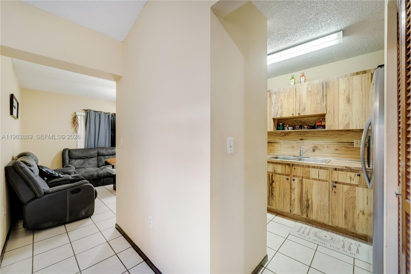 4531 Southwest 144th Avenue Miami, FL 33175 - Photo 6 of 24 a kitchen with cabinets and chairs