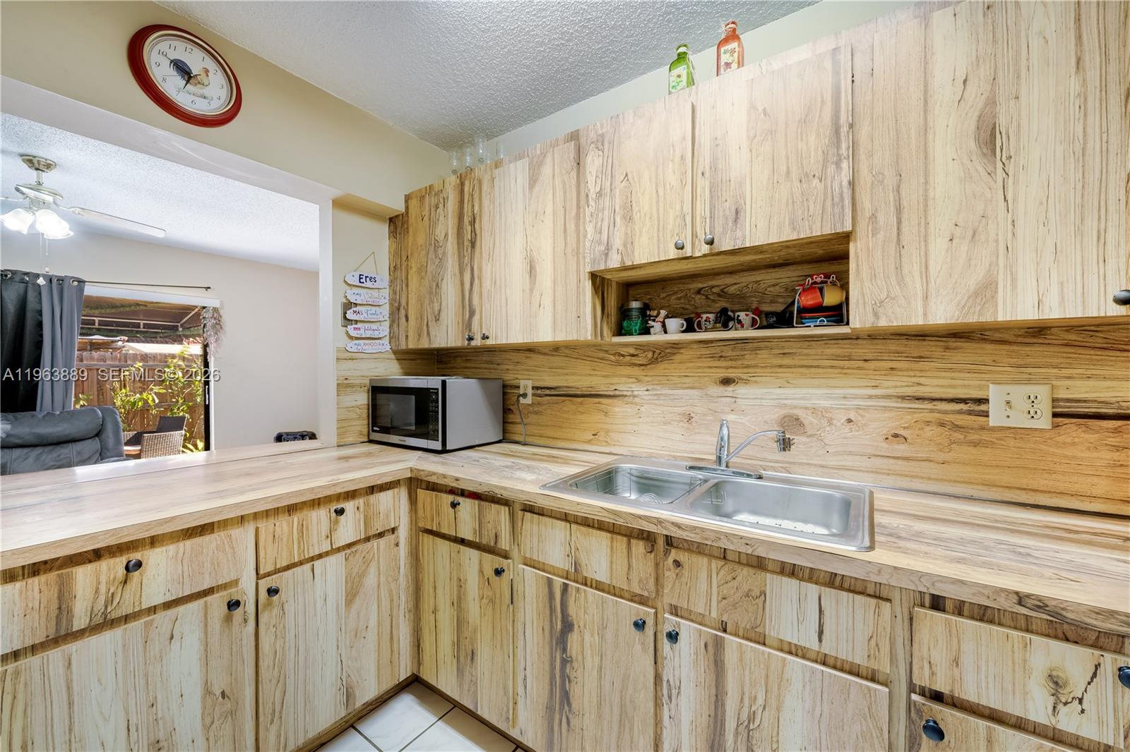 4531 Southwest 144th Avenue Miami, FL 33175 - Photo 7 of 24 a kitchen with stainless steel appliances granite countertop a sink and a stove