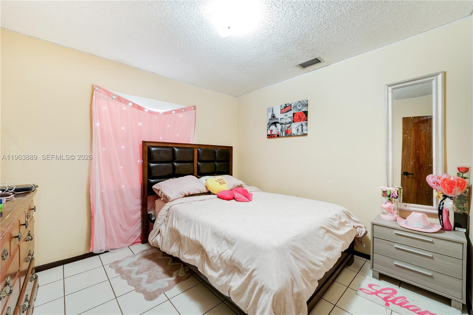4531 Southwest 144th Avenue Miami, FL 33175 - Photo 8 of 24 a bedroom with a bed and a window