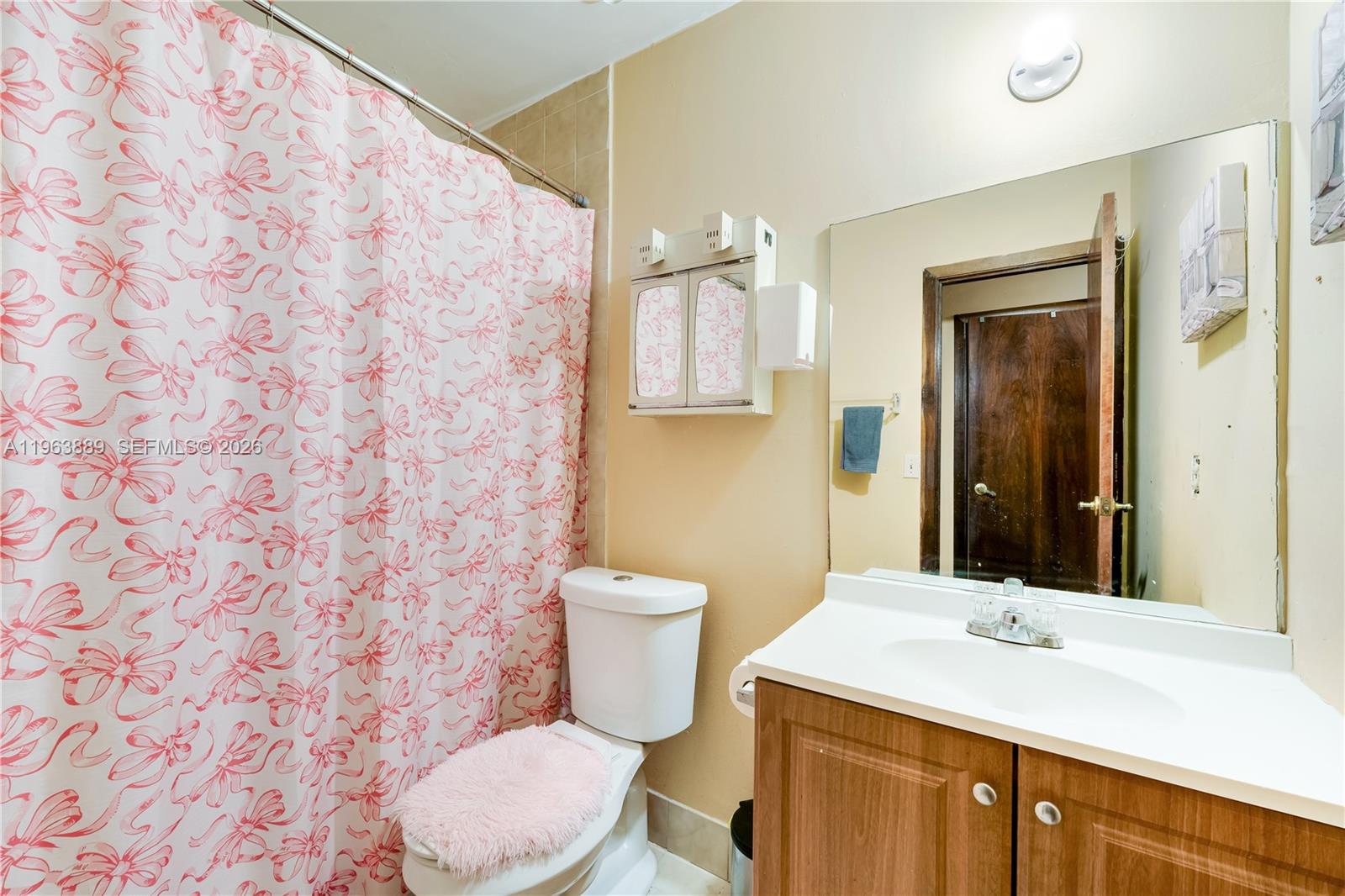 4531 Southwest 144th Avenue Miami, FL 33175 - Photo 10 of 24 a bathroom with a granite countertop sink toilet mirror and a shower
