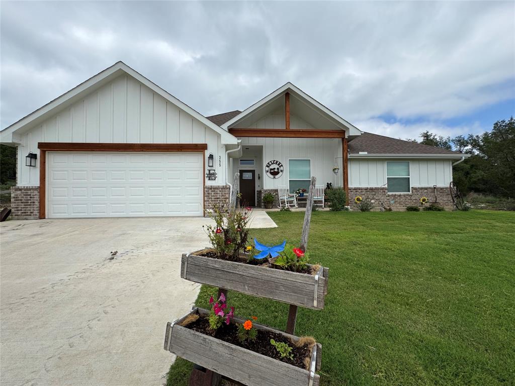 a front view of a house with garden
