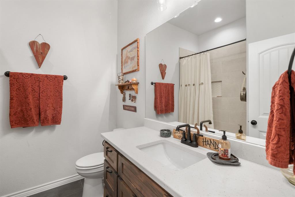355 Sunset Cove Bluff Dale, TX 76433 - Photo 20 of 40 a bathroom with a sink and a mirror